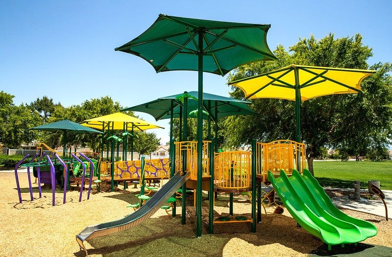 Fabric shade over playground equipment