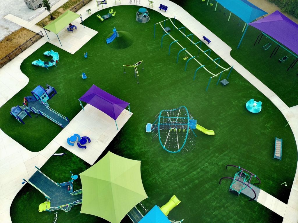 ADA accessible routes to tables, shade, and inclusive play structures