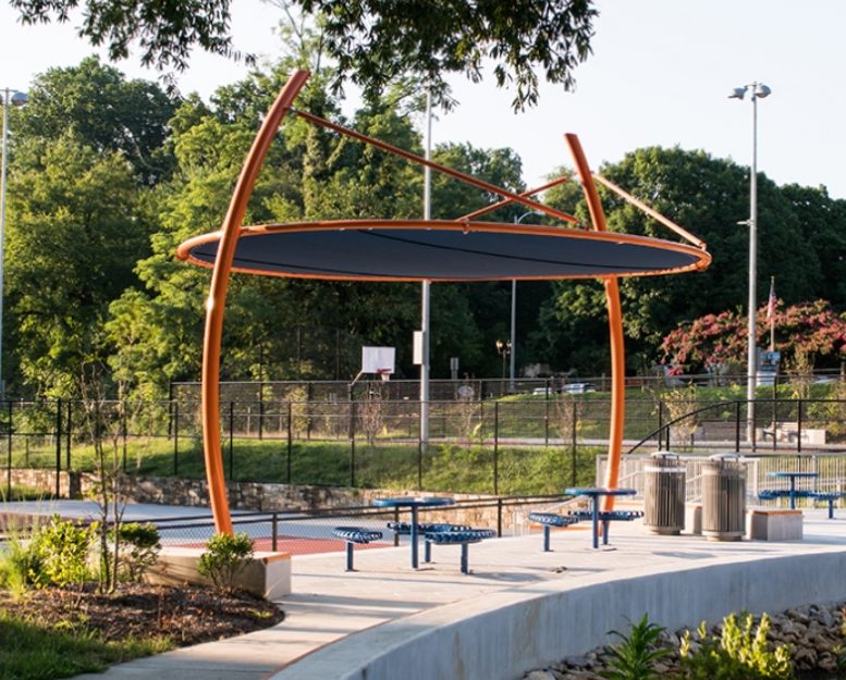 Shade structures and seating near sports courts Shade structures and seating near sports courts