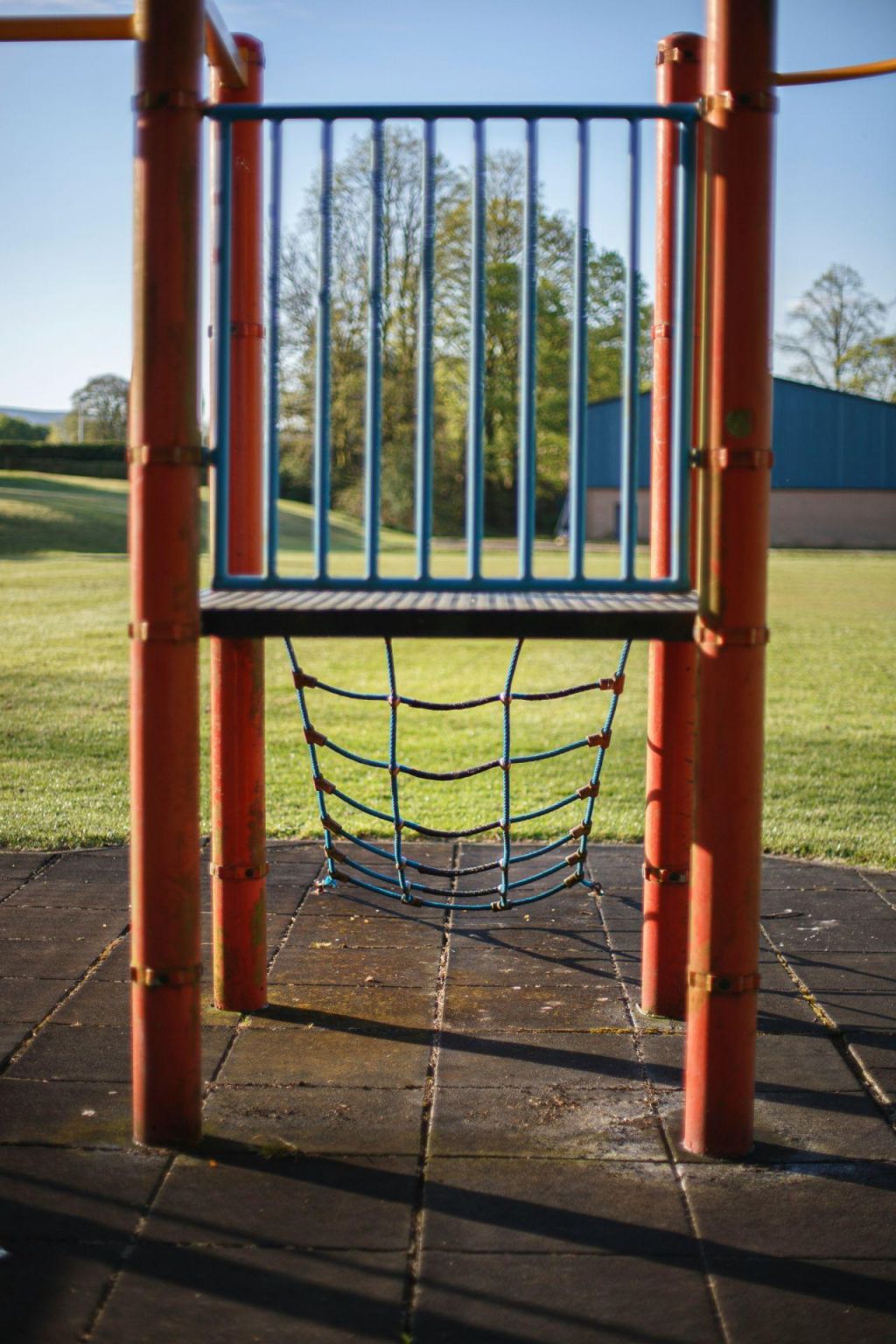Solid playground surfacing with limited play equipment